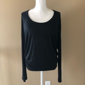 Long-sleeved, draped open back top